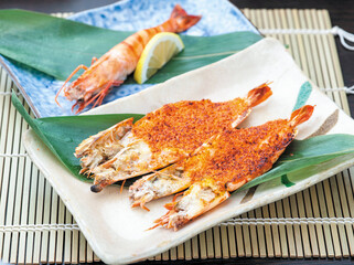 Grilled Ebi Mentaiyak Tiger Prawns served on porcelain plates