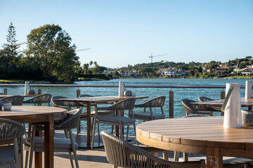 Table and chairs near a lake in Ria Formosa region