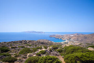 Breathtaking panoramic view of the famous Mylopotas beach in Ios Greece and the island of Sikinos in the background