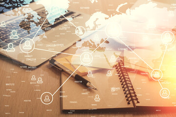 Double exposure of social network drawing and desktop with coffee and items on table background. Concept of international connection.