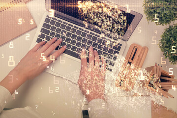 Double exposure of woman hands working on computer and tech theme hologram drawing. Top View. Technology concept.