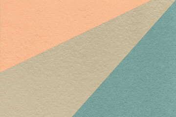 Texture of old craft beige, blue and coral color paper background, macro. Vintage abstract cerulean...