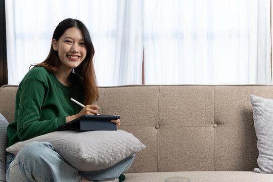 Photo Of Optimistic Nice Girl Work On Laptop From Home Wear Green Shirt.