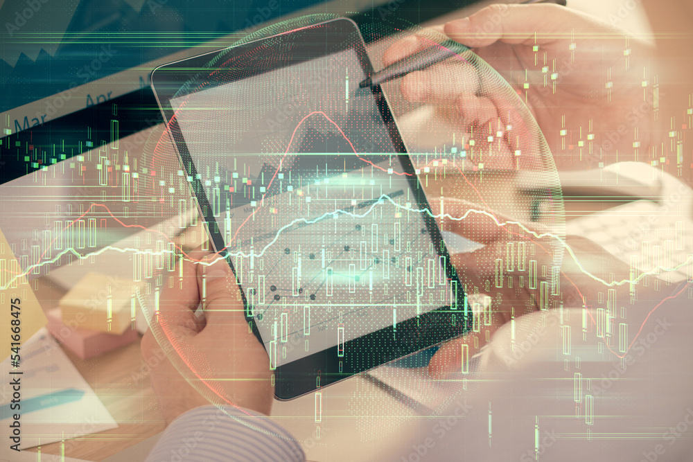 Poster double exposure of man's hands holding and using a phone and financial chart drawing. market analysi