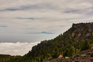 Seas of clouds, lava flows, the Teide of Tenerife in the background and many more spectacular landscapes on the route of the volcanoes (Cumbre Vieja) on the island of La Palma. Canary Islands. Spain