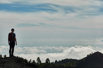 Obraz premium Seas of clouds, lava flows, the Teide of Tenerife in the background and many more spectacular landscapes on the route of the volcanoes (Cumbre Vieja) on the island of La Palma. Canary Islands. Spain