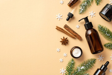 Winter skincare concept. Top view photo of amber pump bottle without label cream jars glass dropper...