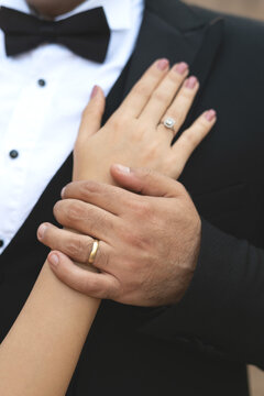 Close-up of wedding couple with wedding rings holding hands,wedding couple