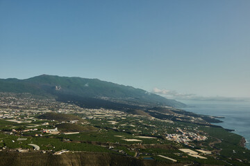 Obraz premium The Tajogaite volcano and its lava flow that reaches the sea seen from the Time viewpoint on the island of La Palma. Canary Islands. Spain