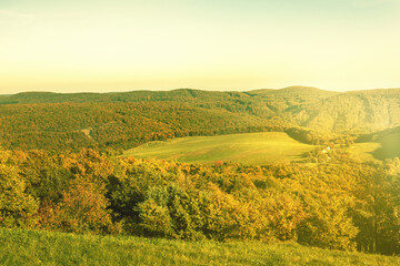 Rural landscape with green fields and forests.Autumn season.