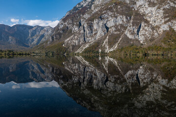 Fototapeta na wymiar Lake Bohinj and Julian Alps in autumn, Slovenia, reflections in the water