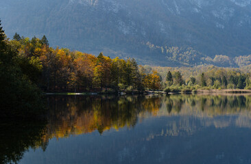 Lake Bohinj and Julian Alps in autumn, Slovenia, reflections in the water
