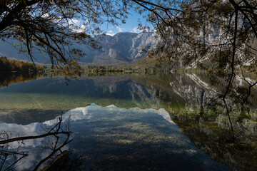 Fototapeta na wymiar Lake Bohinj and Julian Alps in autumn, Slovenia, reflections in the water
