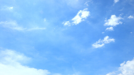 Fototapeta premium Clear blue sky and white clouds. Beautiful white cloud on clear blue sky as nature concept . Clear weather for good summer season. Fresh air breeze. Timelapse motion.