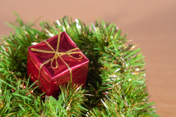 Christmas holidays composition with boxes with gifts inside hanging from the Christmas tree.