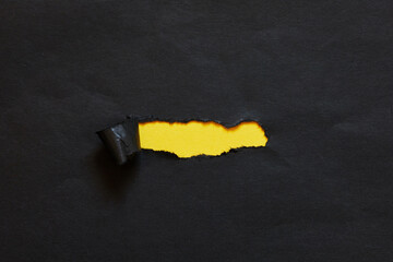 ripped hole in paper