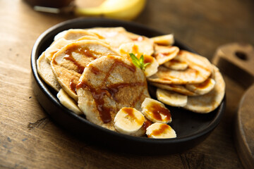 Homemade banana pancakes with caramel sauce