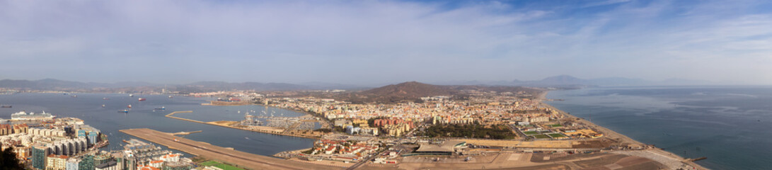 Fototapeta na wymiar View of the City, Airport and Port from top of Rock of Gibraltar. Sunny Morning Sky. Gibraltar, United Kingdom. Panorama