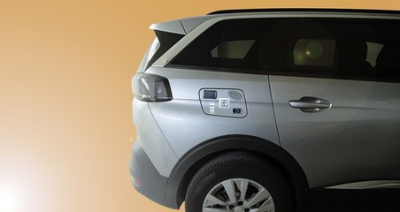 A car with multiple energy charging options isolated on brown background
