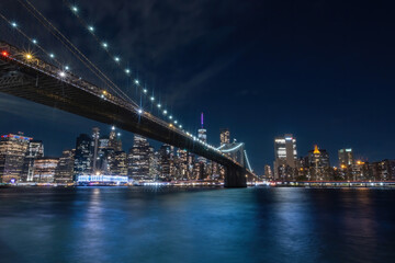 Fototapeta na wymiar View of New York City - beautiful landscape, from Brooklyn Bridge Park, waterfront at night over bridge
