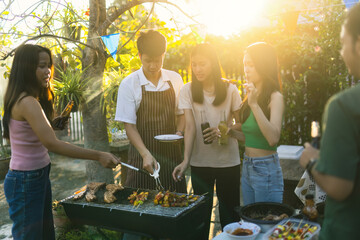 BBQ meeting of an Asian community when friends are happy.