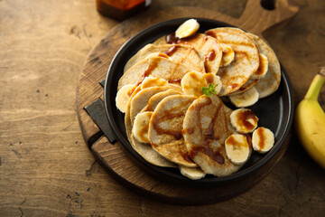Homemade banana pancakes with caramel sauce