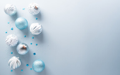 Christmas and new year background decoration concept. Top view of Christmas ball,  star and snowflake on pastel blue background.