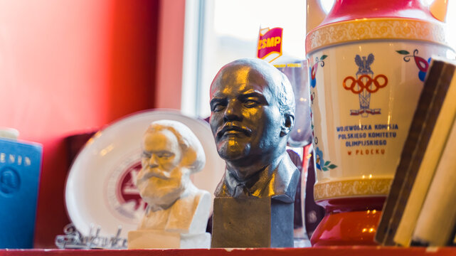 10.20.2022 Warsaw, Poland. Museum of Life under Communism. Busk of Lenin and Marks standing long with other propagandist items of communism. High quality photo