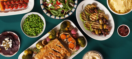 vegetarian Christmas food, carrot welligton, rosted vegetables. Top view