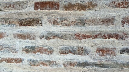 Old ancient vintage white and beige brick stone wall texture background 