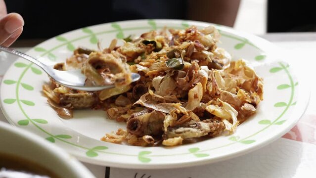 Fried Pork Chitterlings with ceramic plate