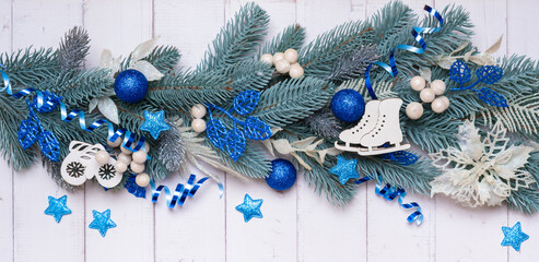 Christmas banner made from pine tree, berries and festive decorations top view. Christmas flat lay