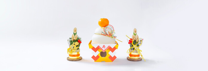 Japanese New Year. Kagami mochi and Kadomatsu on the white background. 日本のお正月。白背景上の鏡餅と門松。