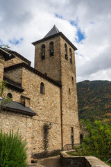 Fototapeta na wymiar Autumnal view of Romanesque church of Torla, in Huesca, Spain, vertical