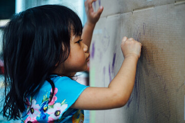 Asian children learn to write, Little Asian Child drawing at home