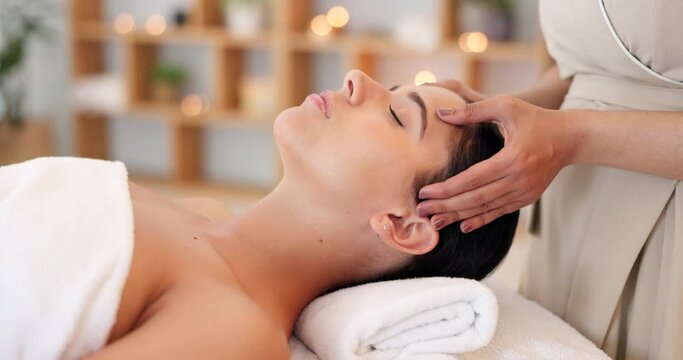 Facial, massage and woman at a spa for skincare, wellness and luxury therapy at a salon. Young, sleeping and girl with hands for a cosmetic face treatment to relax and calm the body at a clinic