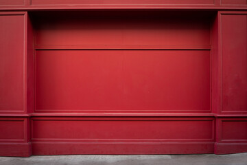 Red wooden traditional facade in an old town in England. No people, copy space. Frontal view with sidewalk. closed wall. Background for composing. England