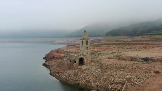 Aerial view of Sau Reservoir, in the Ter River, in the Province of Girona, Catalonia, Spain. After months without rain the level of the swamp is very low.