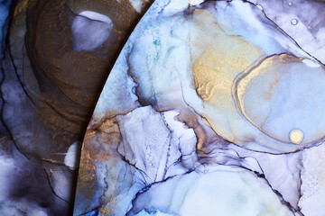 Obraz premium Alcohol ink abstract background. Blue golden luxury acrylic paint in water. Texture of marble. Print pattern