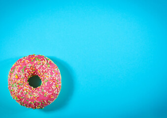 Top view of donut on blue background