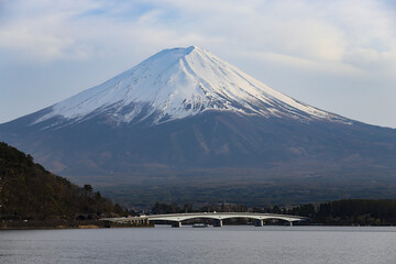 Fuji mountain with snow cover on the top with bridge and Kawaguchi Lake