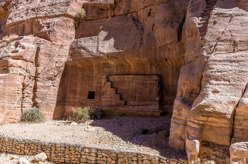 A view of burial sites close to the path in the ancient city of Petra, Jordan in summertime