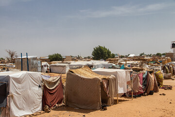 Refugee camp (IDP - Internal displaced persons) taking refuge from armed conflict between opposition groups and government. Very poor living conditions, lack of water, hygiene, shelter and food - obrazy, fototapety, plakaty