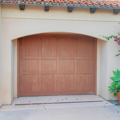 Square Garage exterior with wooden door and arched entrance at La Jolla, California
