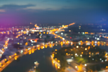 Blurred lights from peak tower. Blurry view of city traffic lights and car at night. Night bokeh light in big city, abstract blur defocused background. 