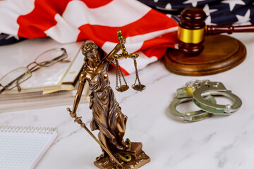 Standing at lawyer desk is statue Justice of Peace on law in court gavel surrounded by administration document folders - obrazy, fototapety, plakaty