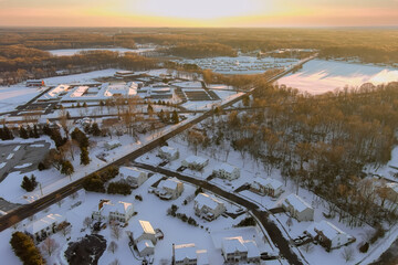 In this aerial view of landscape small town with home complex covered in snow wonderful winter scenery after snowfall in New Jersey USA.