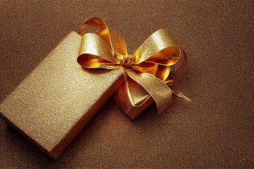 Golden glittery gift box isolated, 