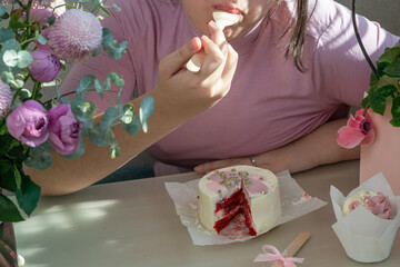 Girl eating birthday bento cake.
