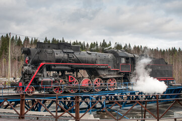 Fototapeta na wymiar Old, vintage steam locomotive on railway